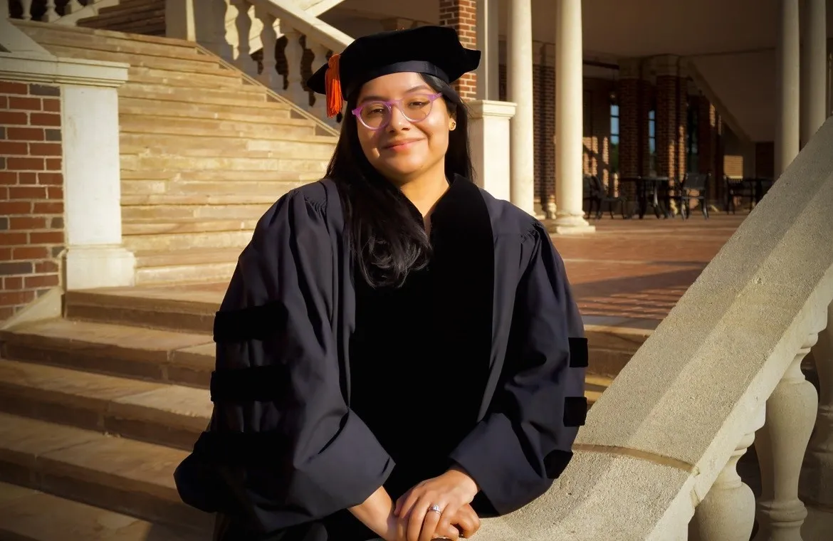 Dr. Maggie León-Corwin in cap and gown